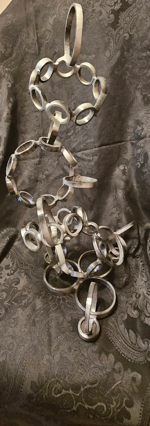 A silver chain with rings on it