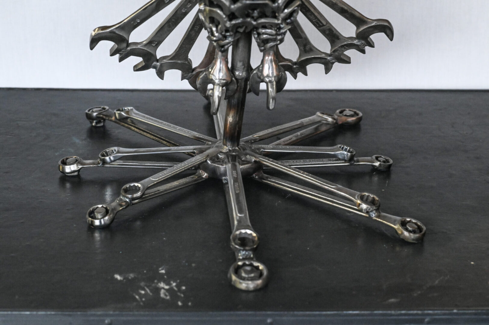 A table with many wrenches on it