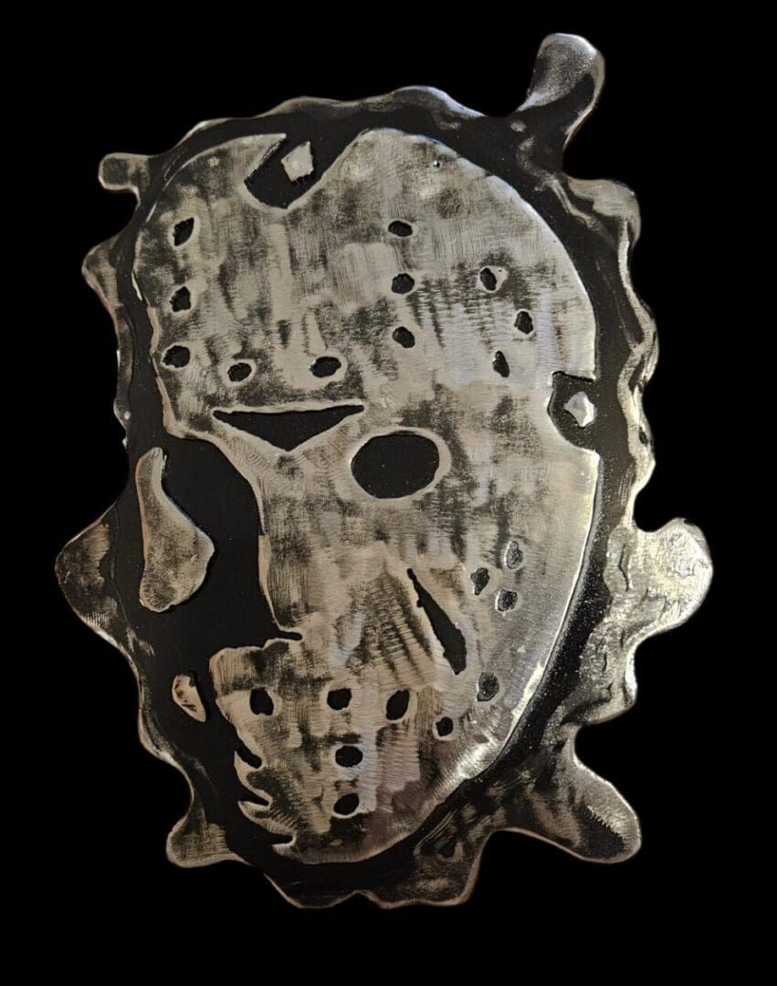 Metal sculpture of a hockey mask.