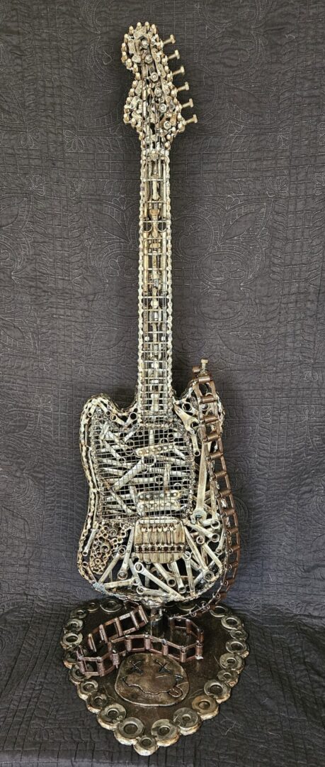 Metal sculpture of an electric guitar.