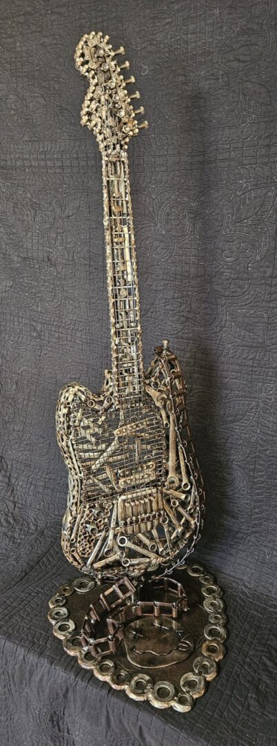 Metal sculpture of a guitar