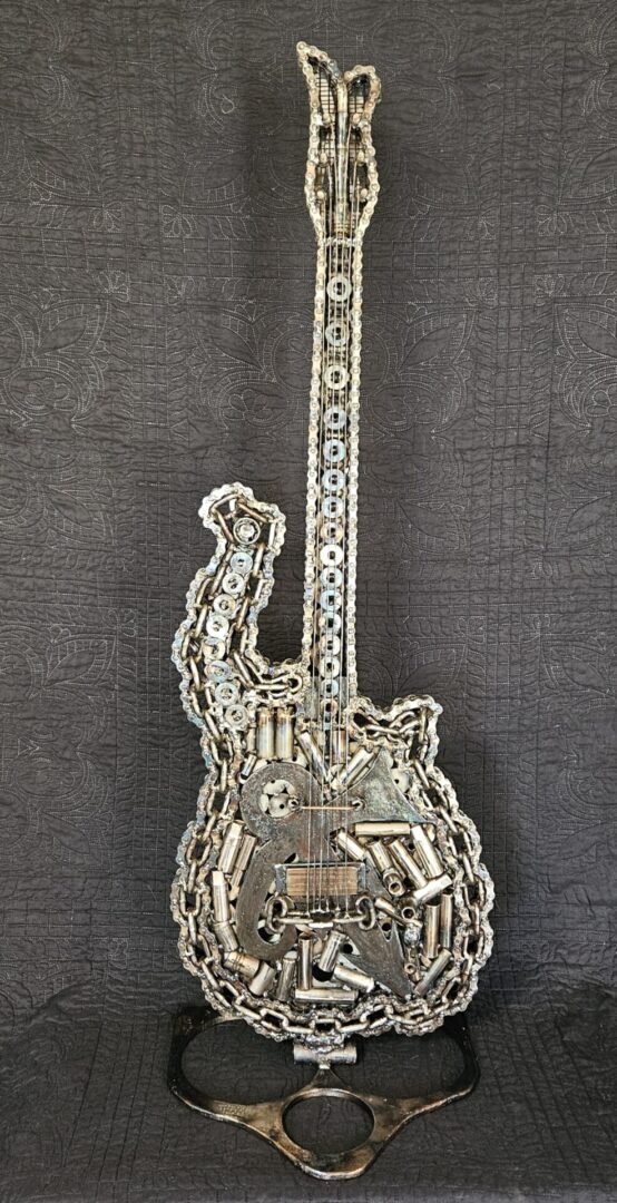 Metal sculpture of an electric guitar.